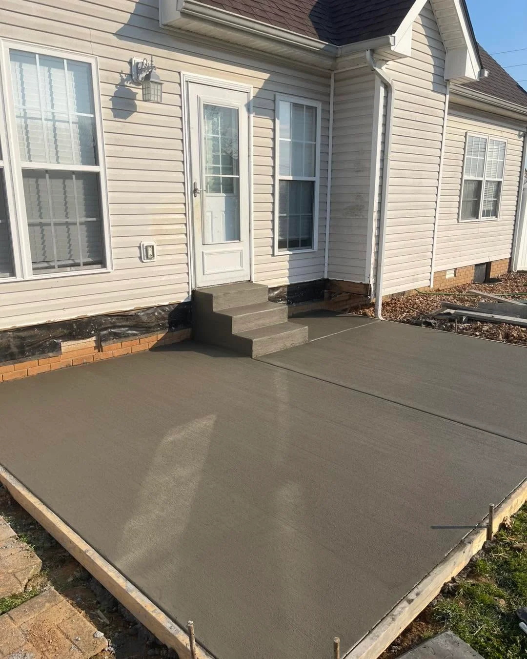 Fresh backyard concrete patio in Clarksville, TN