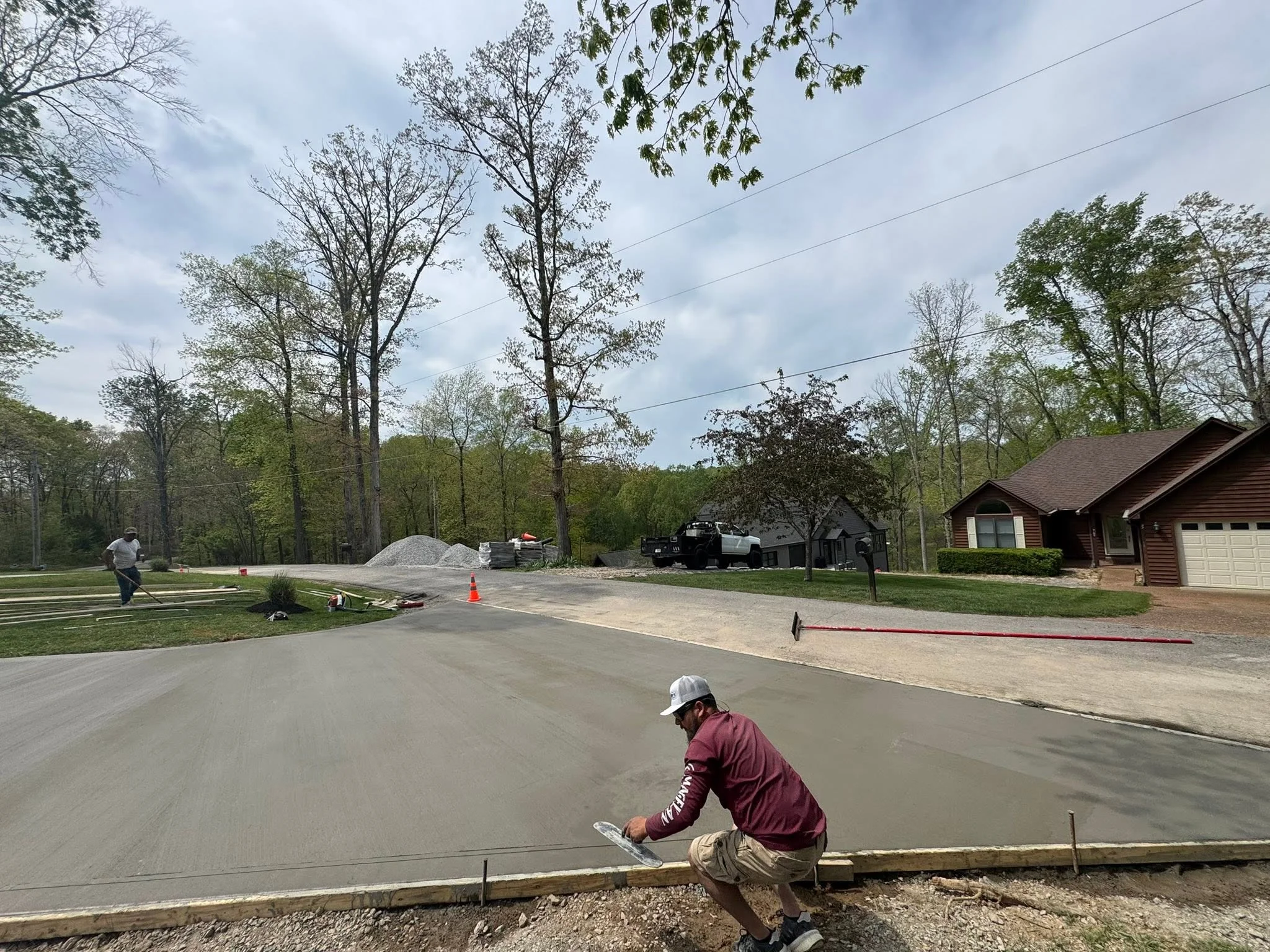 Crew finishing a large concrete driveway in Clarksville, TN